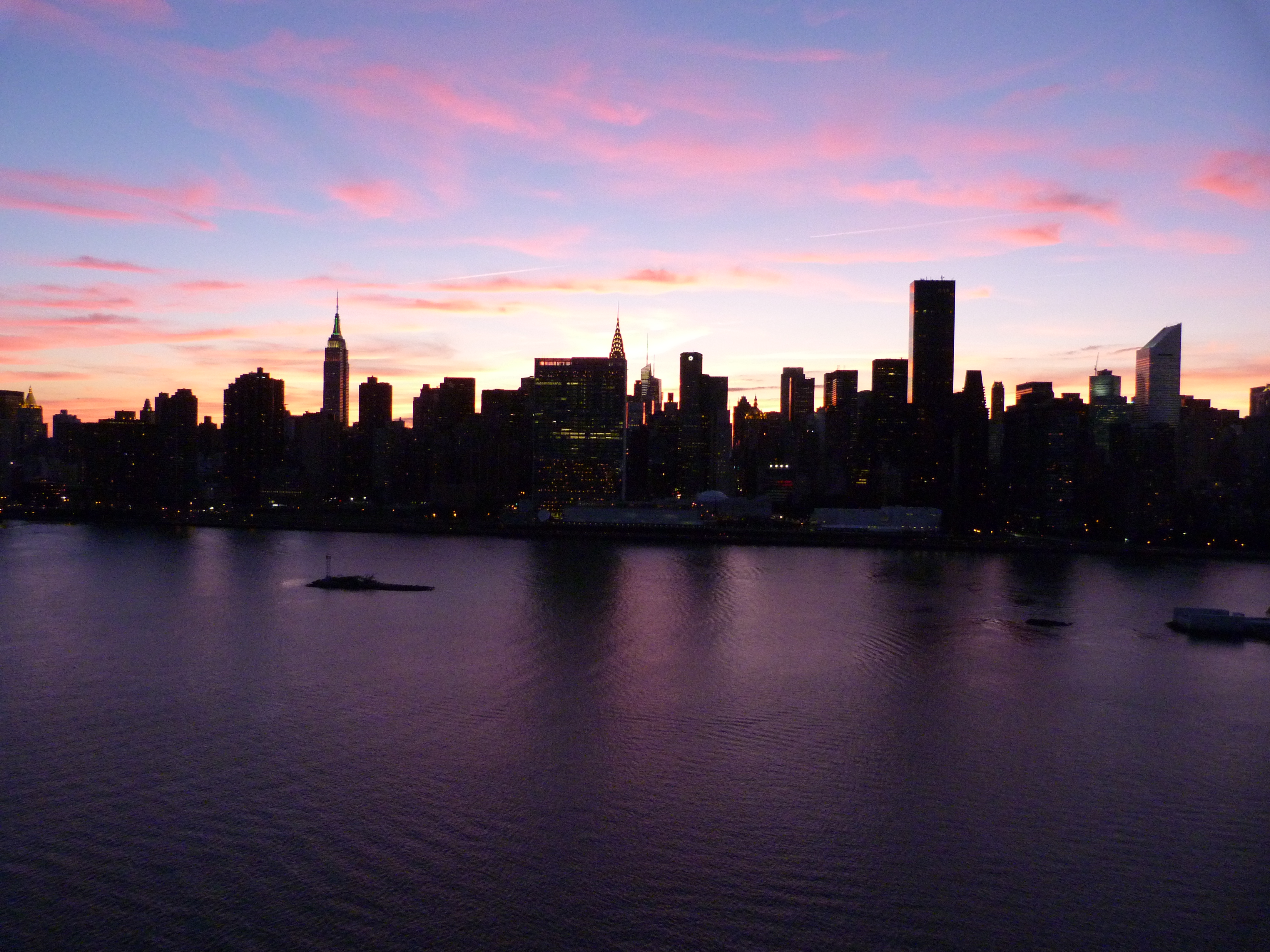 The sun sets on Manhattan